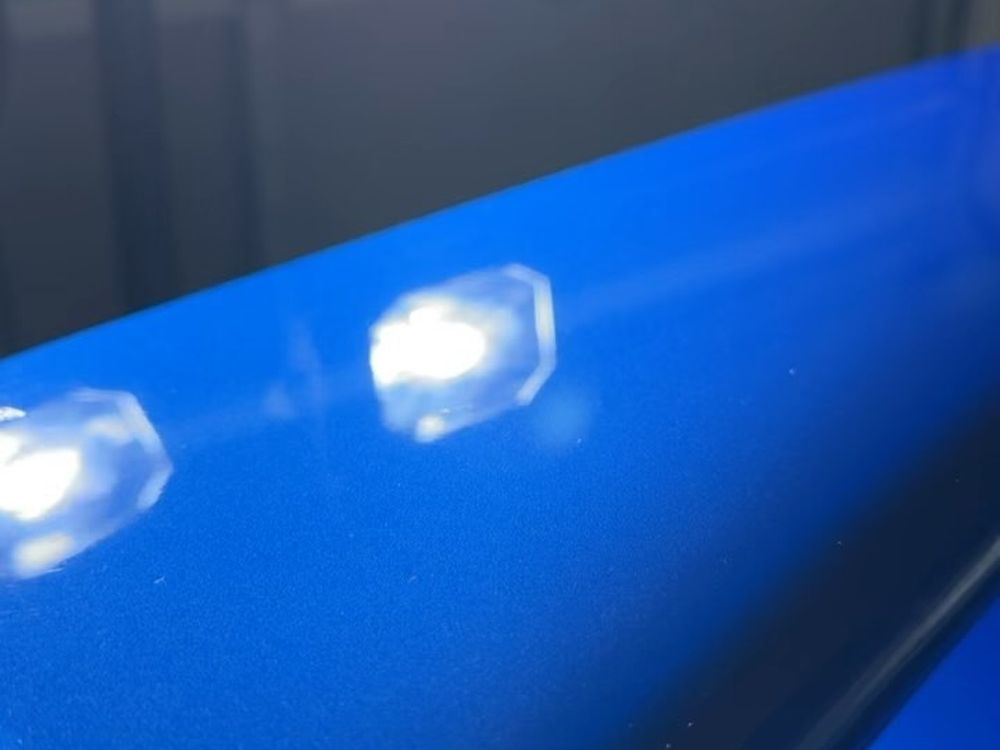 Blue Subaru STI paint after a two-step correction